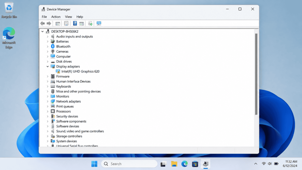 Windows Device Manager showing Intel Graphics driver with yellow warning icon under Display adapters